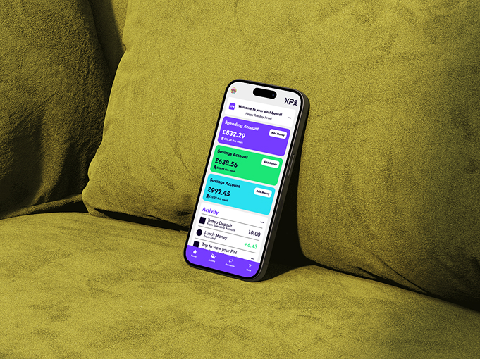 XP Bank app mockup on sofa